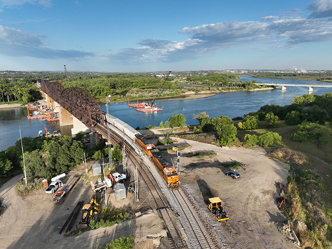 A grain train moves over the new bridge. 