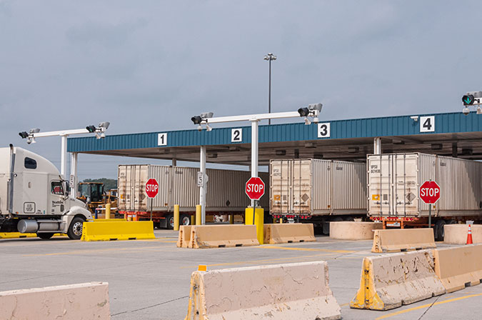 Outbound trucks leave the facility, which will see even more activity during peak season.