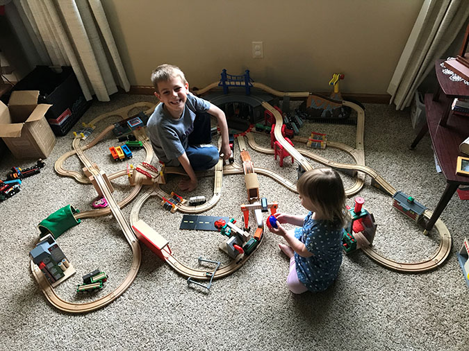 Jacob, his sister, Hailey, and his extensive toy train set